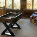 A table football game in the middle of a room.